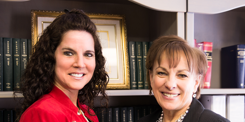 A Picture of attorney Maureen Kroll and her office manager.